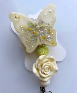 Yellow butterfly badge reel