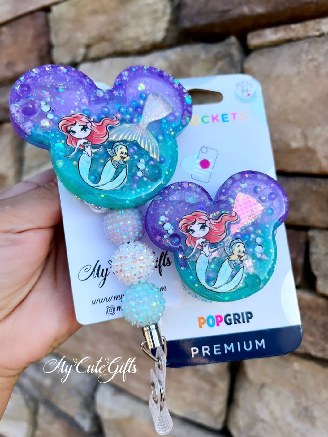 Badge reel and pop socket
