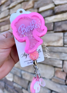 Barbie shaker badge reel