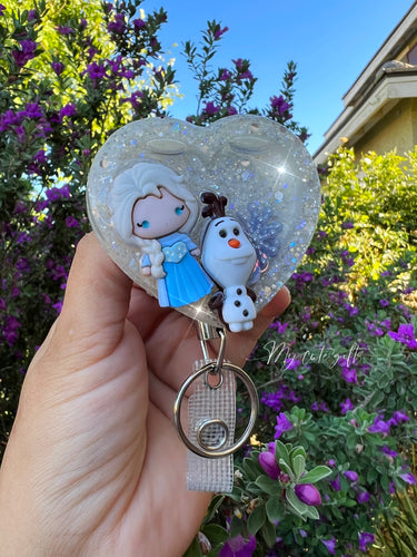 Badge reel shaker