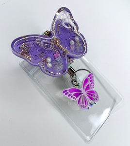 Butterfly shaker badge reel