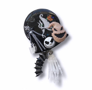 Badge reel shaker